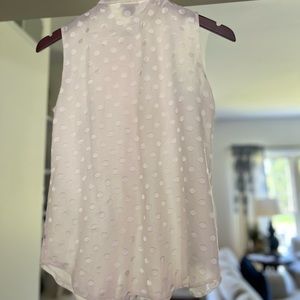 Ann Taylor cream sleeveless top with shimmering circles, XS.